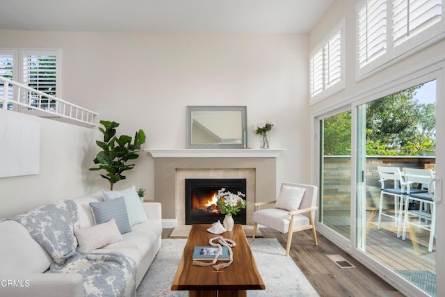 1051 Thomas Ln, Ventura, CA 93003 - living room featuring wood finished floors, a fireplace, and a high ceiling