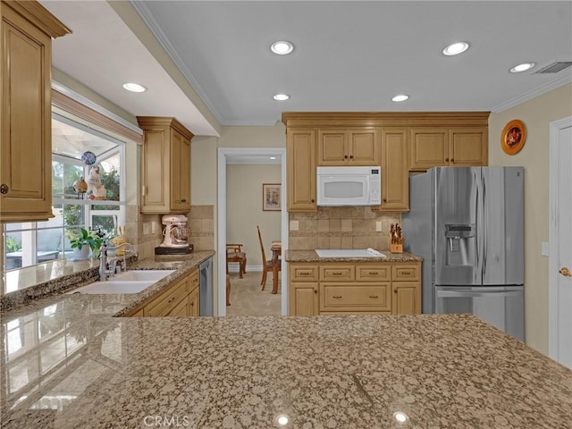 28702 Eagleton St, Agoura Hills, CA 91301 - kitchen with appliances with stainless steel finishes, crown molding, light stone counters, recessed lighting, and tasteful backsplash