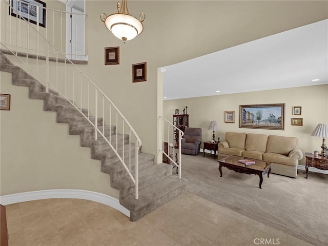 28702 Eagleton St, Agoura Hills, CA 91301 - staircase with tile patterned flooring, carpet, a towering ceiling, and recessed lighting