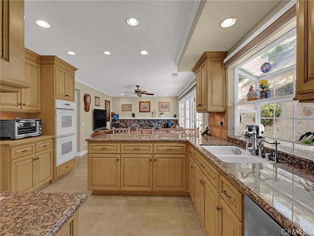 28702 Eagleton St, Agoura Hills, CA 91301 - kitchen featuring decorative backsplash, double oven, a peninsula, recessed lighting, and ceiling fan