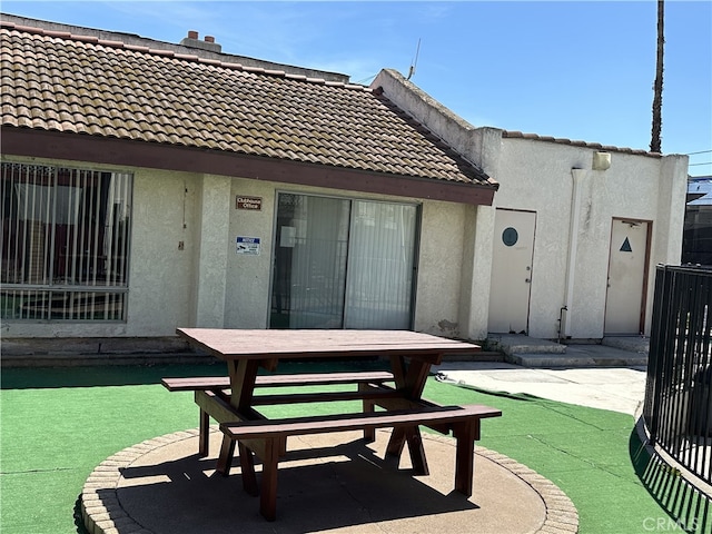 23611 Golden Springs Dr Unit I3, Diamond Bar, CA 91765 - back of house with a tiled roof, stucco siding, a patio, and outdoor dining area