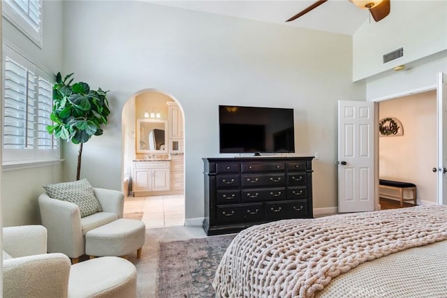 6915 Stanislaus Pl, Rancho Cucamonga, CA 91701 - bedroom with a towering ceiling, connected bathroom, arched walkways, and ceiling fan
