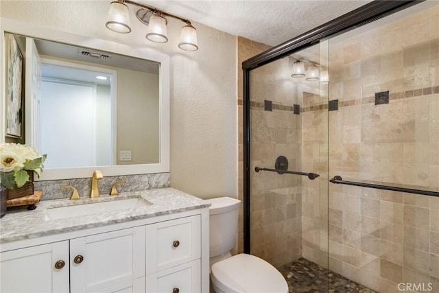 6915 Stanislaus Pl, Rancho Cucamonga, CA 91701 - full bathroom with a stall shower, a textured wall, vanity, and a textured ceiling