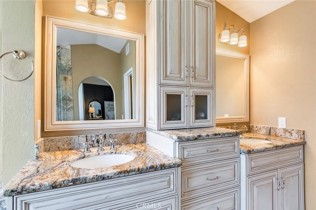 6915 Stanislaus Pl, Rancho Cucamonga, CA 91701 - bathroom featuring double vanity and a textured wall