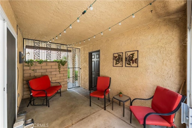 39981 Golfers Ln, Palmdale, CA 93551 - living area with a textured wall, concrete flooring, and a textured ceiling