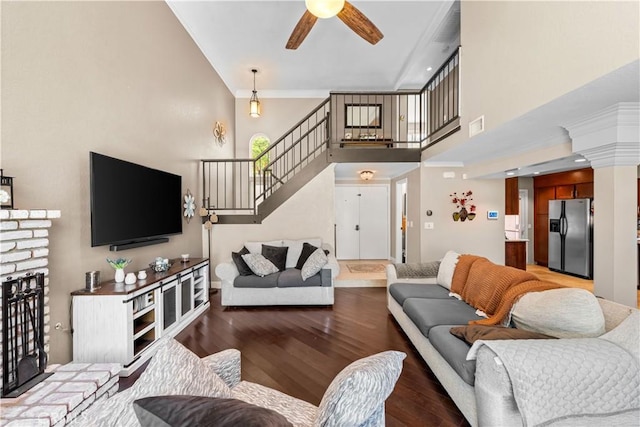 39981 Golfers Ln, Palmdale, CA 93551 - living area featuring stairs, ceiling fan, a towering ceiling, wood finished floors, and crown molding