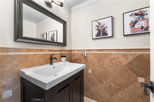 39981 Golfers Ln, Palmdale, CA 93551 - bathroom with ornamental molding, vanity, tile walls, and a wainscoted wall