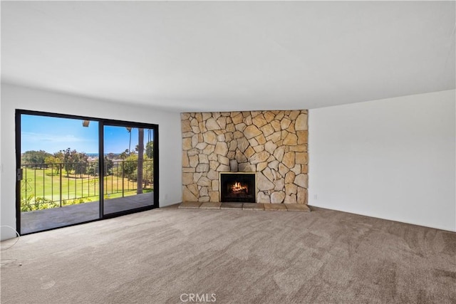 2501 S El Camino Real, San Clemente, CA 92672 - unfurnished living room featuring carpet floors and a stone fireplace