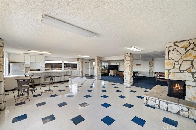 2501 S El Camino Real, San Clemente, CA 92672 - garage with freestanding refrigerator and a stone fireplace