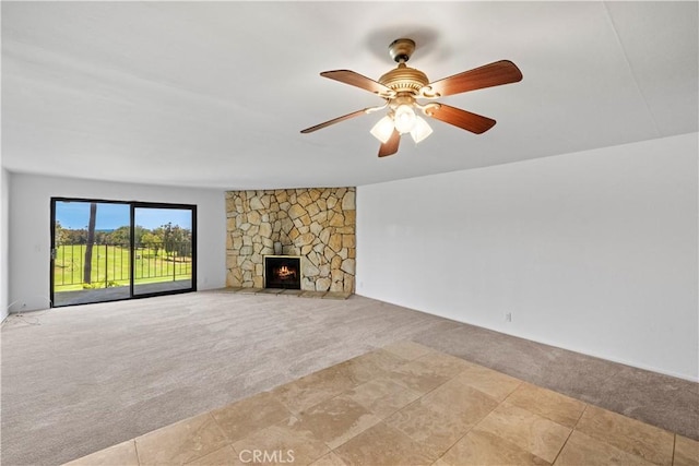2501 S El Camino Real, San Clemente, CA 92672 - unfurnished living room with light colored carpet, a stone fireplace, and ceiling fan