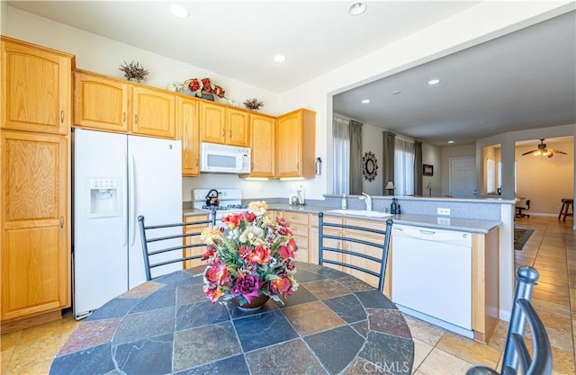 19385 Boulder St, Apple Valley, CA 92308 - kitchen with white appliances, a peninsula, recessed lighting, a center island, and ceiling fan