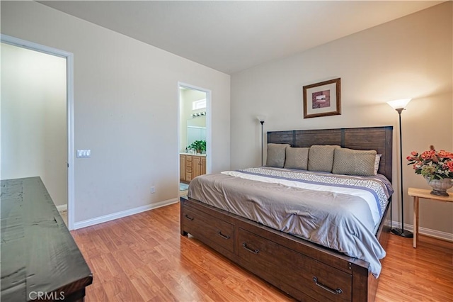 19385 Boulder St, Apple Valley, CA 92308 - bedroom featuring light wood finished floors and ensuite bath