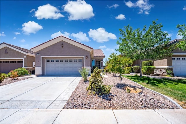 19385 Boulder St, Apple Valley, CA 92308 - ranch-style home featuring stucco siding, a garage, driveway, and a tiled roof