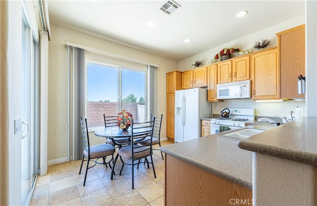 19385 Boulder St, Apple Valley, CA 92308 - kitchen with white appliances, recessed lighting, and light brown cabinetry