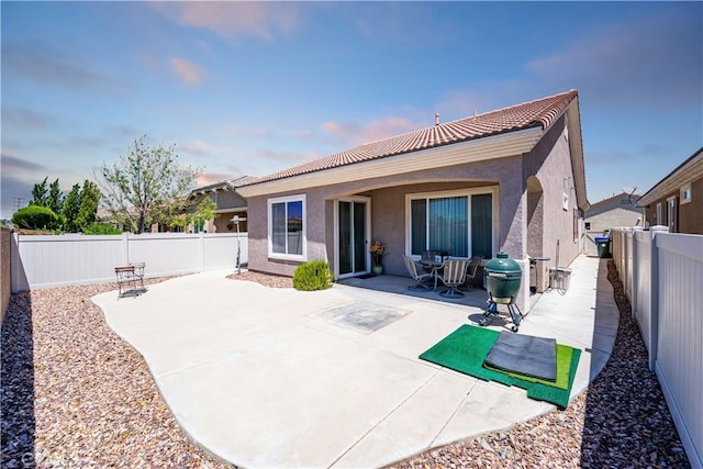19385 Boulder St, Apple Valley, CA 92308 - rear view of property with stucco siding, a tile roof, a fenced backyard, and a patio