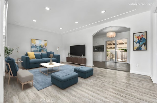 4449 Walnut St, Baldwin Park, CA 91706 - living area featuring arched walkways, wood finished floors, and recessed lighting