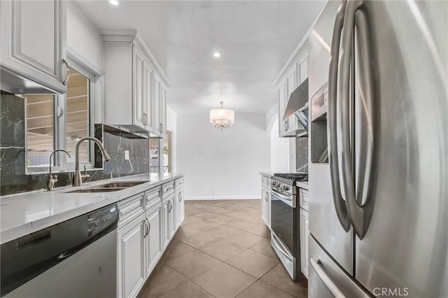 4449 Walnut St, Baldwin Park, CA 91706 - kitchen featuring appliances with stainless steel finishes, tasteful backsplash, white cabinets, extractor fan, and recessed lighting
