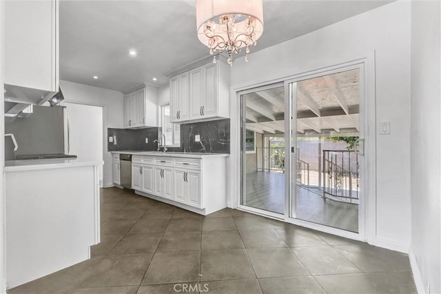 4449 Walnut St, Baldwin Park, CA 91706 - kitchen with tasteful backsplash, white cabinetry, stainless steel dishwasher, light countertops, and recessed lighting