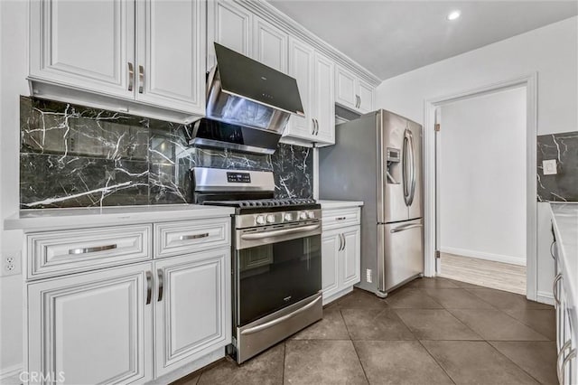 4449 Walnut St, Baldwin Park, CA 91706 - kitchen with appliances with stainless steel finishes, extractor fan, white cabinetry, and tasteful backsplash