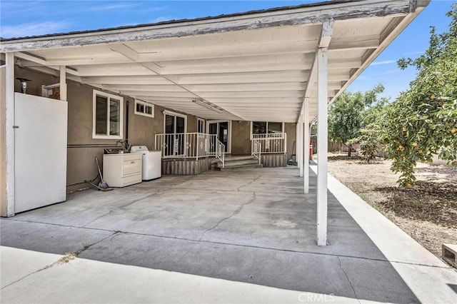 4449 Walnut St, Baldwin Park, CA 91706 - view of patio / terrace featuring independent washer and dryer and a carport