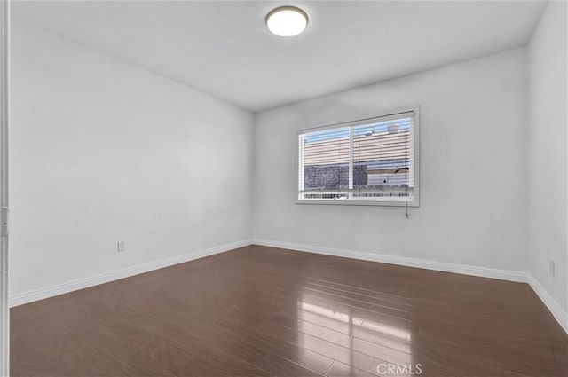 4449 Walnut St, Baldwin Park, CA 91706 - empty room with dark wood-style floors and baseboards