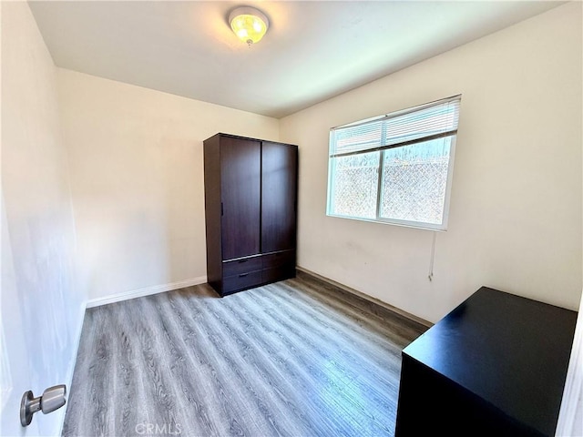 4449 Walnut St, Baldwin Park, CA 91706 - unfurnished bedroom featuring wood finished floors