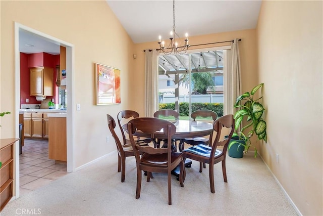 20776 Freeport Dr, Riverside, CA 92508 - dining space with a chandelier, healthy amount of natural light, light carpet, and vaulted ceiling