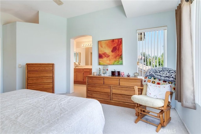 20776 Freeport Dr, Riverside, CA 92508 - bedroom featuring arched walkways, light colored carpet, and connected bathroom