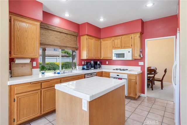 20776 Freeport Dr, Riverside, CA 92508 - kitchen featuring white appliances, tile counters, light tile patterned floors, a center island, and recessed lighting