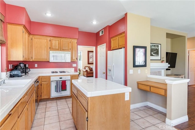 20776 Freeport Dr, Riverside, CA 92508 - kitchen featuring white appliances, tile countertops, light tile patterned floors, a center island, and recessed lighting
