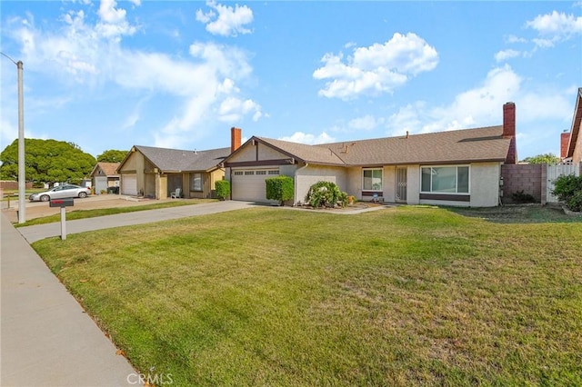 6355 Ortega St, Chino, CA 91710 - single story home with a garage, driveway, stucco siding, and a chimney