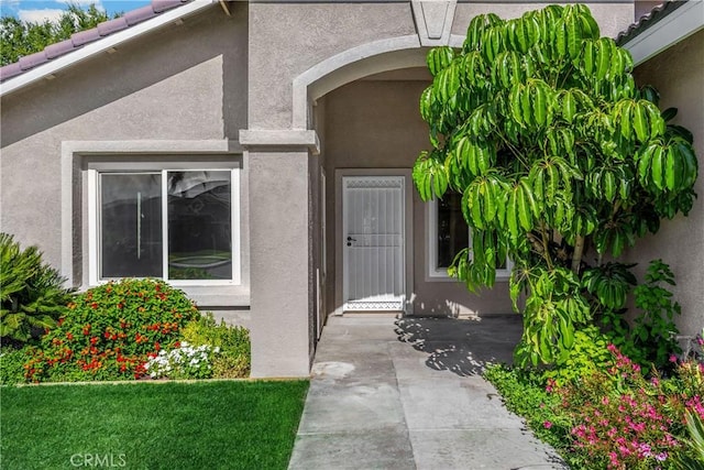 4082 N Flame Tree Ave, Rialto, CA 92377 - entrance to property featuring stucco siding