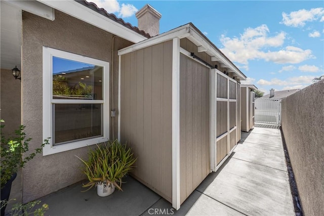4082 N Flame Tree Ave, Rialto, CA 92377 - view of home's exterior featuring a chimney and stucco siding