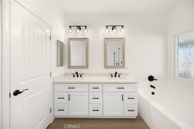 4082 N Flame Tree Ave, Rialto, CA 92377 - bathroom featuring double vanity and a garden tub