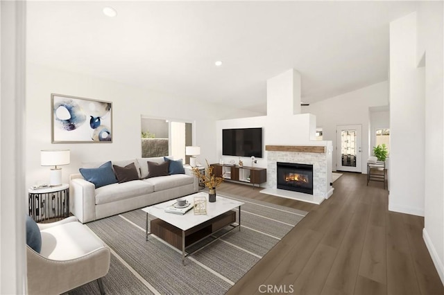 4082 N Flame Tree Ave, Rialto, CA 92377 - living room with a stone fireplace, lofted ceiling, wood finished floors, and recessed lighting