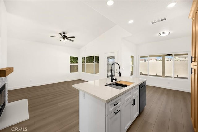 4082 N Flame Tree Ave, Rialto, CA 92377 - kitchen with dark wood-style flooring, ceiling fan, stainless steel dishwasher, open floor plan, and recessed lighting