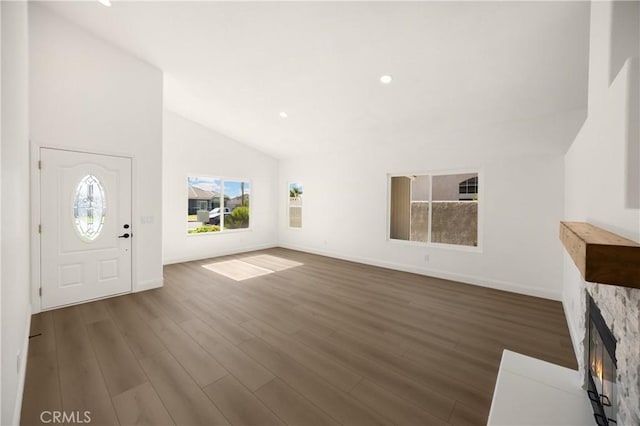 4082 N Flame Tree Ave, Rialto, CA 92377 - foyer entrance featuring lofted ceiling, wood finished floors, recessed lighting, and a fireplace