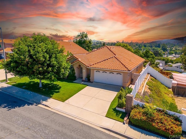 426 Debra An Dr, Fallbrook, CA 92028 - mediterranean / spanish house with a tiled roof, a garage, concrete driveway, and stucco siding