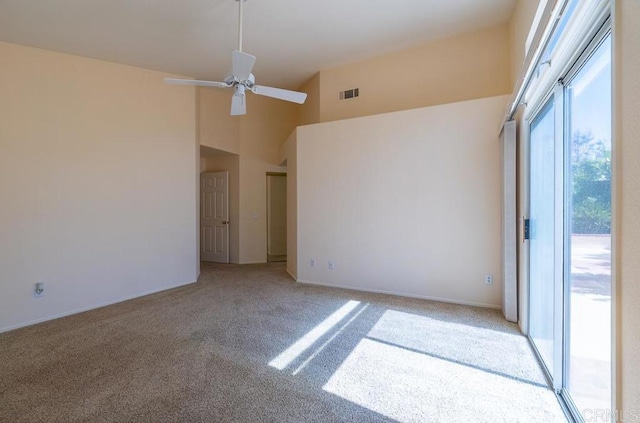 426 Debra An Dr, Fallbrook, CA 92028 - empty room with a ceiling fan, light colored carpet, and a towering ceiling