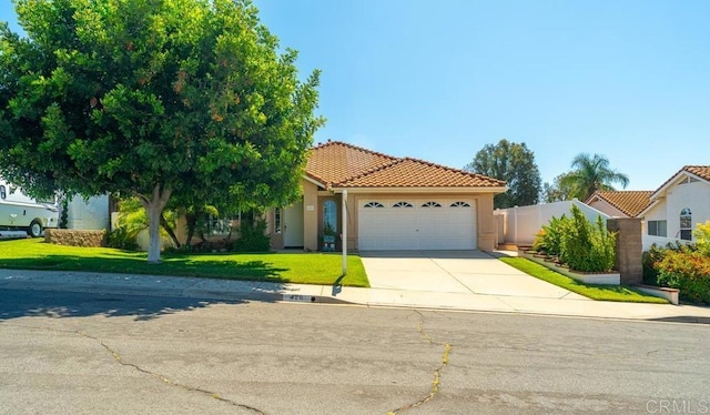 426 Debra An Dr, Fallbrook, CA 92028 - view of front of house featuring an attached garage, stucco siding, a tiled roof, and driveway