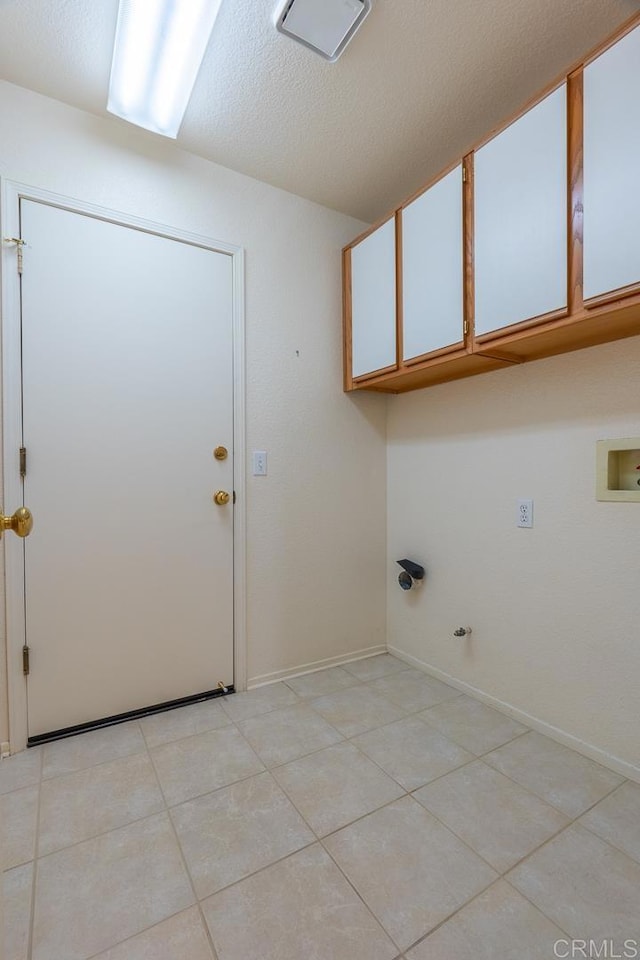 426 Debra An Dr, Fallbrook, CA 92028 - laundry room with cabinet space, washer hookup, light tile patterned floors, and gas dryer hookup