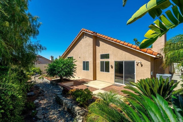 426 Debra An Dr, Fallbrook, CA 92028 - back of property with stucco siding, a tiled roof, and a patio area
