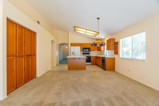 426 Debra An Dr, Fallbrook, CA 92028 - kitchen featuring white appliances, arched walkways, brown cabinets, a center island, and light countertops