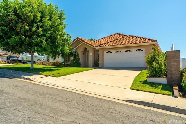 426 Debra An Dr, Fallbrook, CA 92028 - mediterranean / spanish house with stucco siding, a tiled roof, an attached garage, a front yard, and concrete driveway