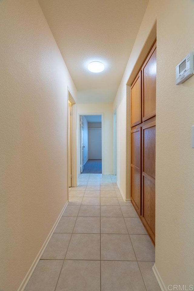 426 Debra An Dr, Fallbrook, CA 92028 - corridor featuring light tile patterned flooring and baseboards