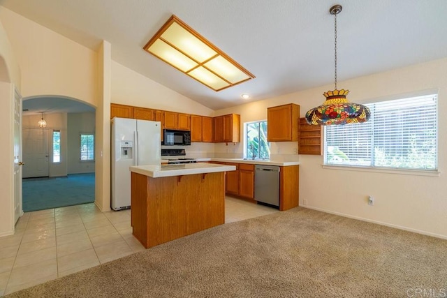 426 Debra An Dr, Fallbrook, CA 92028 - kitchen featuring white fridge with ice dispenser, stainless steel dishwasher, black microwave, light carpet, and arched walkways