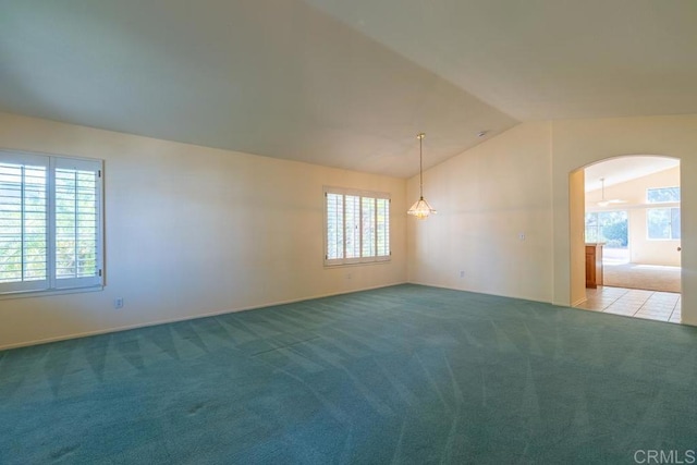 426 Debra An Dr, Fallbrook, CA 92028 - carpeted empty room with arched walkways and vaulted ceiling