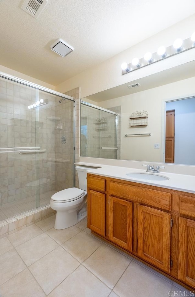 426 Debra An Dr, Fallbrook, CA 92028 - full bathroom featuring vanity, tile patterned floors, a shower stall, and a textured ceiling
