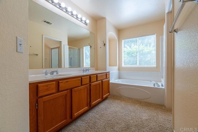 426 Debra An Dr, Fallbrook, CA 92028 - bathroom featuring a shower stall, double vanity, a bath, carpet floors, and a textured wall