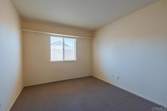 426 Debra An Dr, Fallbrook, CA 92028 - spare room featuring dark colored carpet and baseboards